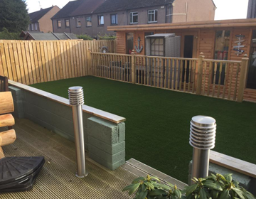 Artificial grass with spotlights during the day