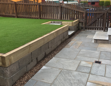 Raised area framed and finished with artificial grass